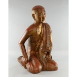 20th century carved wood figure of a Buddhist monk, height 72cm,