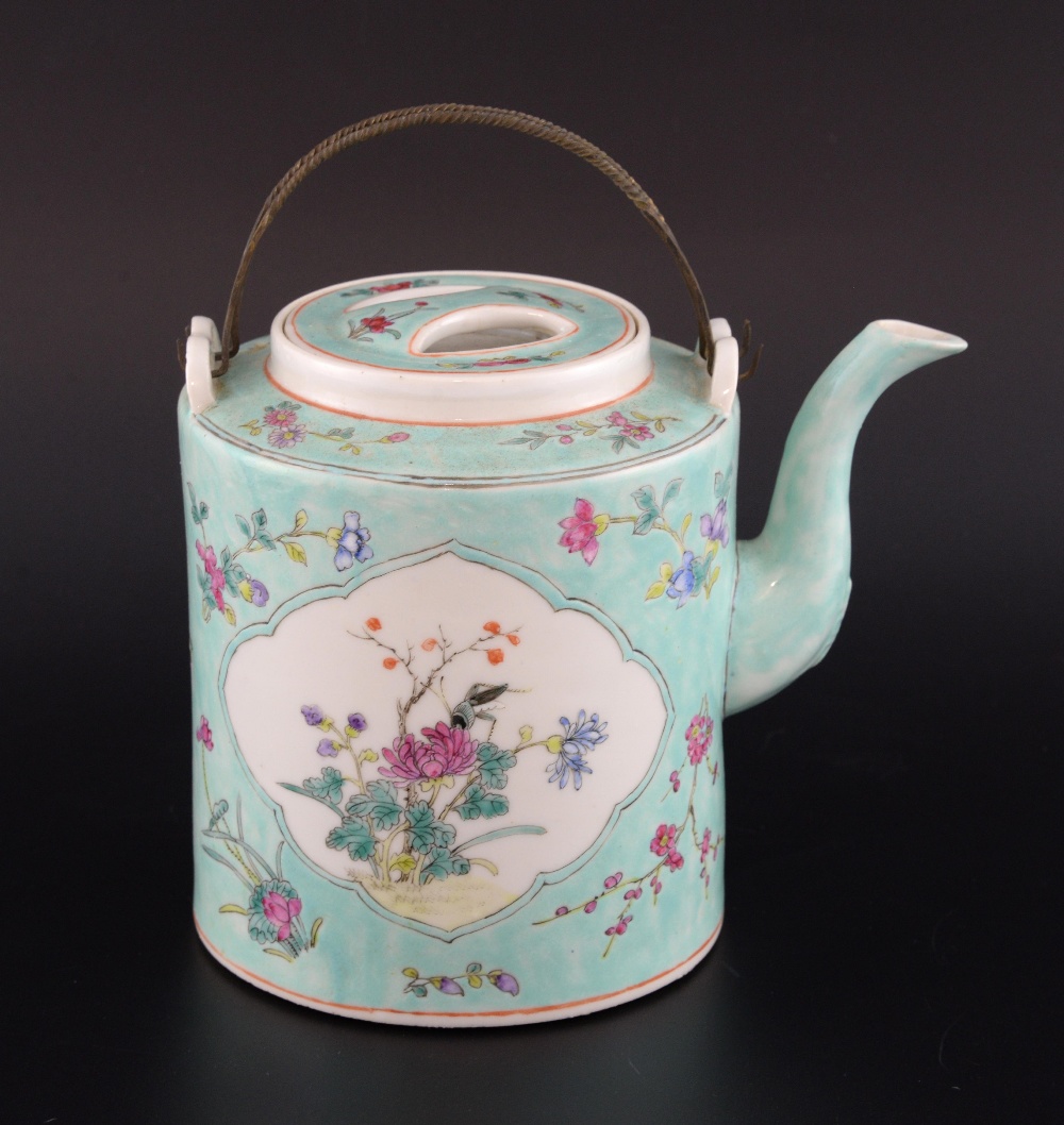 Chinese famille rose teapot and cover, the light blue ground decorated with two panels of a bird and
