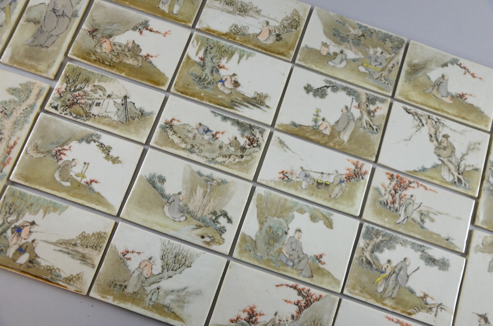 Set of twenty-eight late 19th/ early 20th century Chinese porcelain tiles depicting figures at - Image 12 of 17