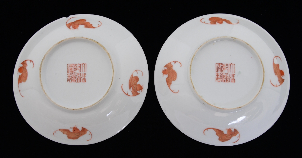 Pair of Chinese famille noir porcelain saucers with floral decoration, iron red marks and four - Image 2 of 2