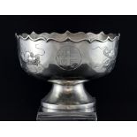 Chinese silver bowl with wavy rim, engraved with dragons and characters, on round foot,