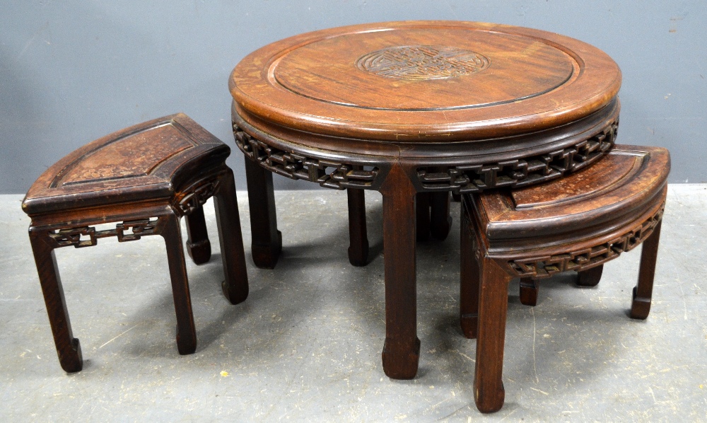 Chinese circular hardwood table with four quarter tables below, diameter 76cm, 49cm high,