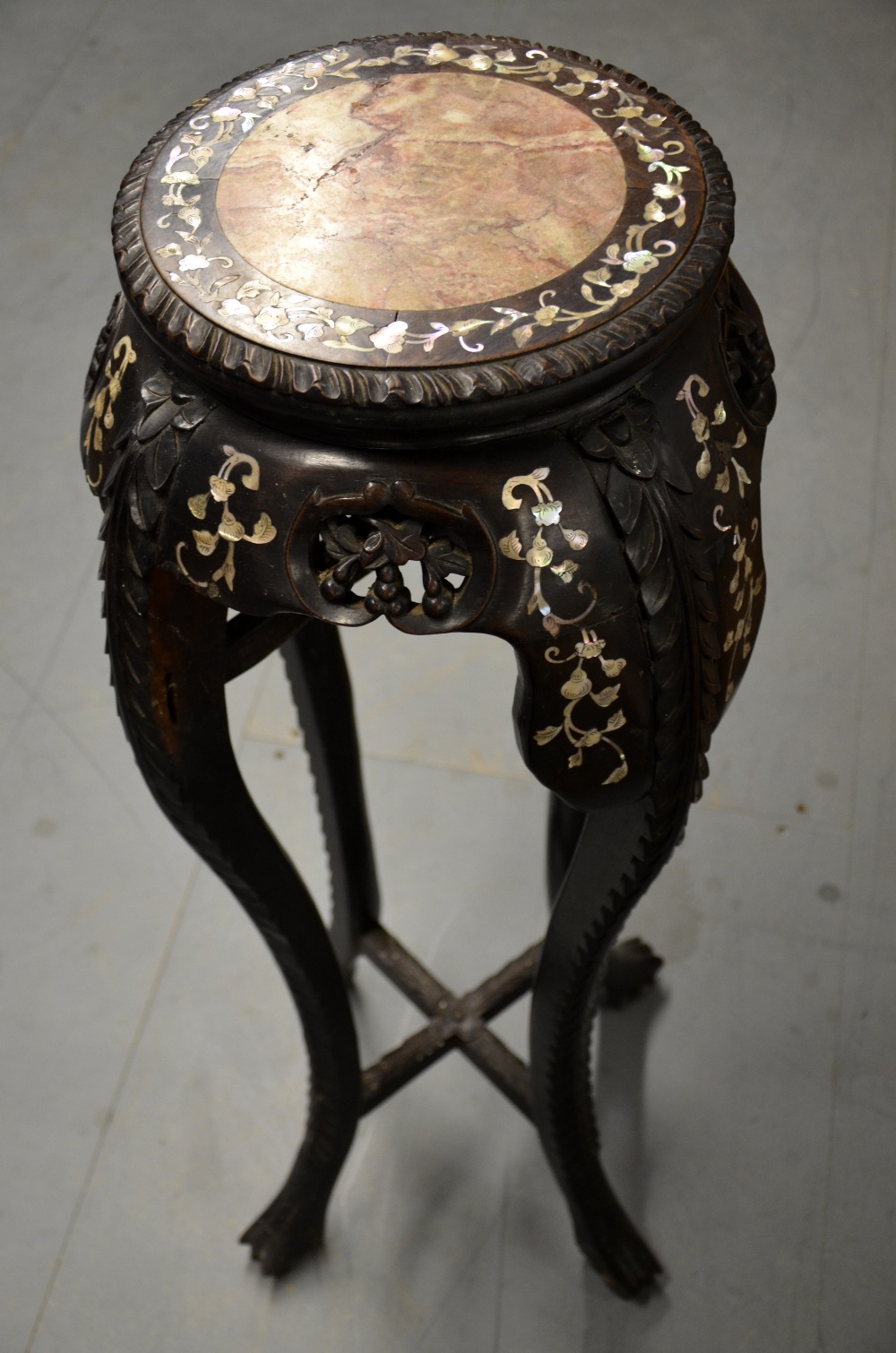 Late 19th century Chinese rosewood plant stand with brown marble inset top,