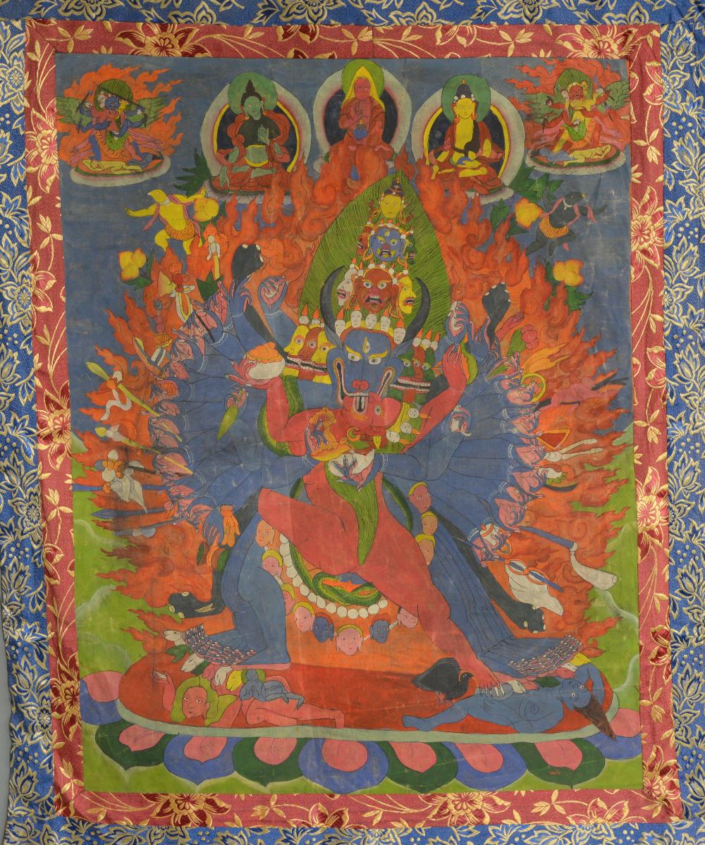 Tibetan Thangka painting depicting a many armed and legged figure with horned animals head being - Image 2 of 2