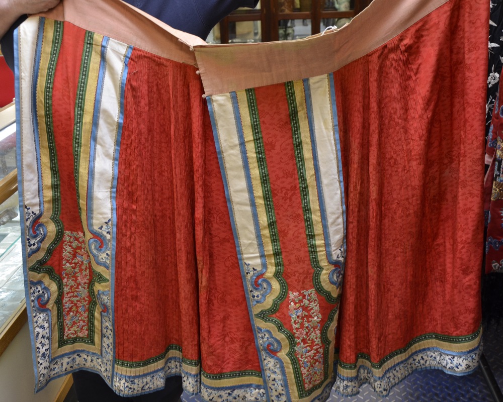 19th C Chinese male skirt, of brocaded red silk, pleated on the reverse, front appliqu‚d with - Image 2 of 5