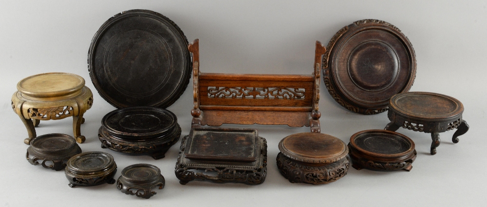 Collection of 19th century and later Chinese carved hardwood stands with pierced decoration, various
