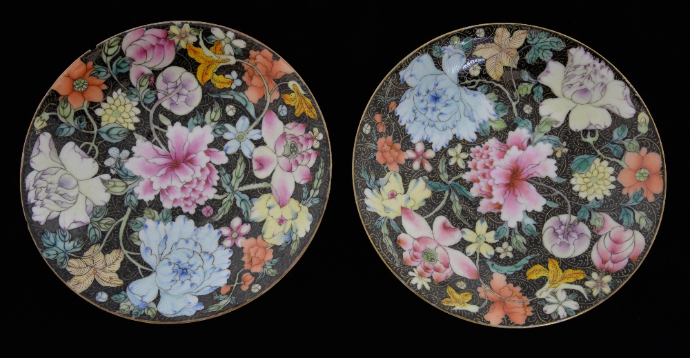 Pair of Chinese famille noir porcelain saucers with floral decoration, iron red marks and four