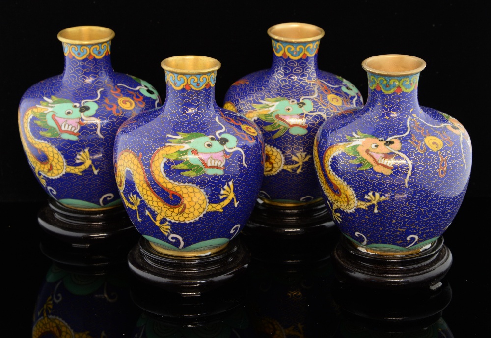 Four modern Chinese cloisonne vases, the blue ground decorated with dragons chasing the flaming
