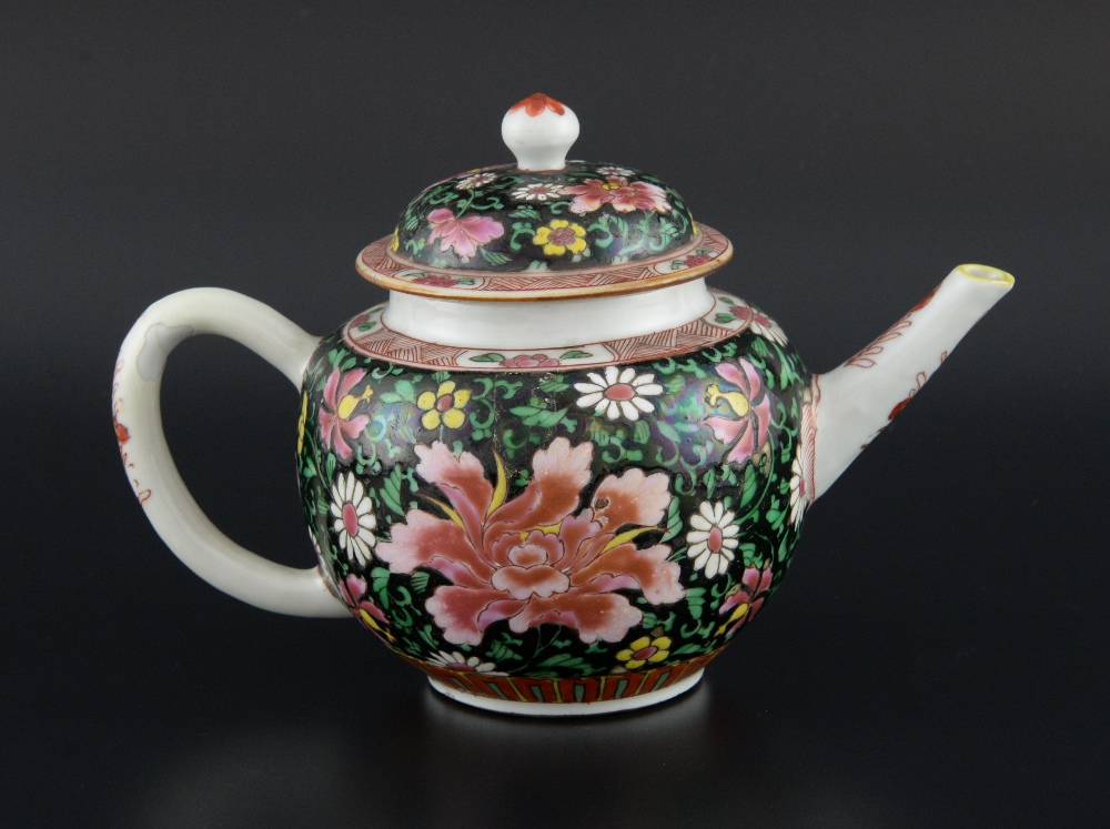 Chinese famille noir teapot and cover decorated with flowers and foliage, 13.5cm high,
