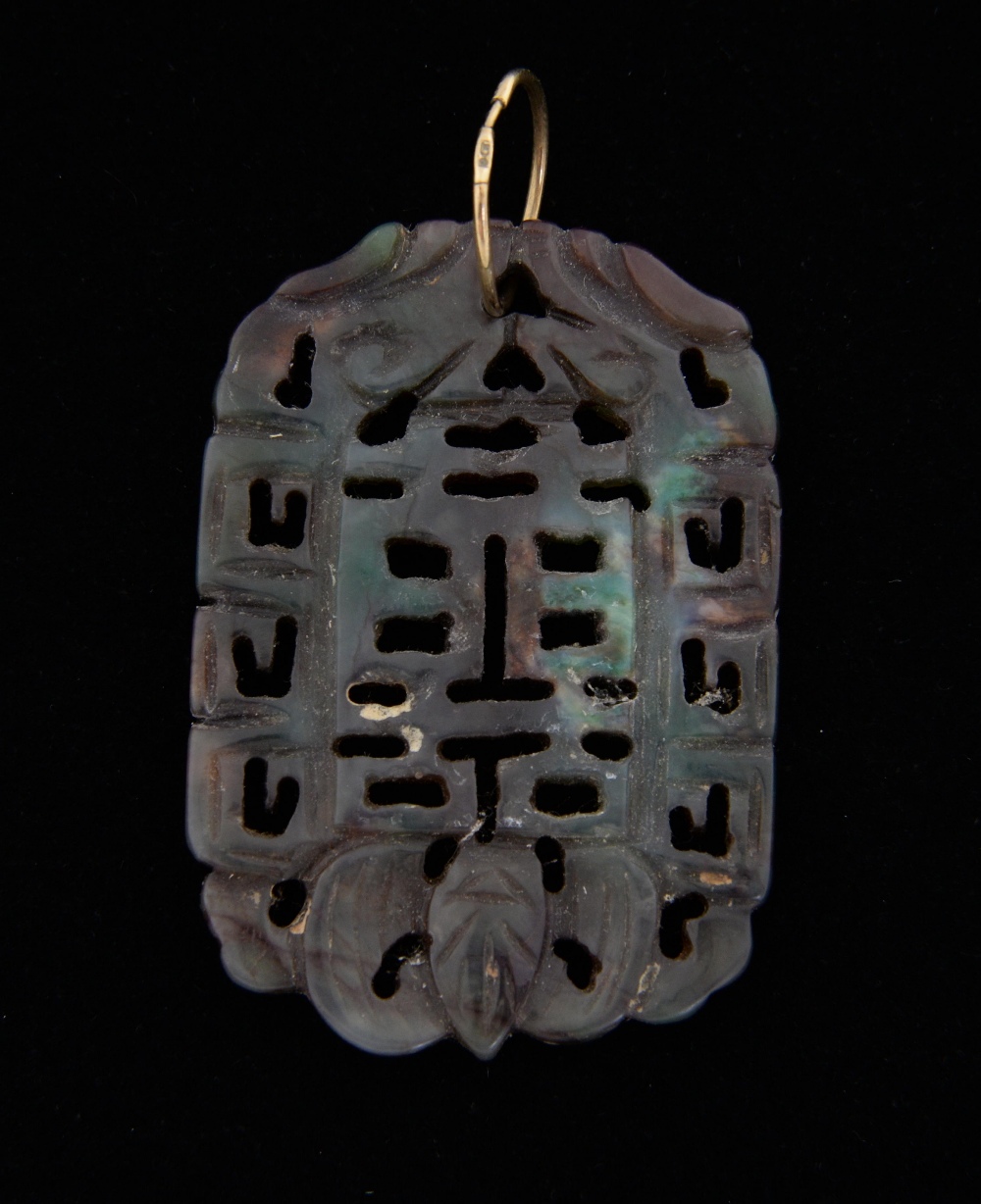Chinese hardstone pendant carved with a bat and characters, 6.1cm x 4.2cm,