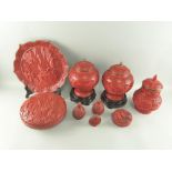 Collection of modern red cinnabar lacquered items to include pair of vases and covers, plate, bowl