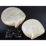 Pair of 19th century Chinese Mother of pearl shells carved with landscapes, 25cm by 23cm  one with