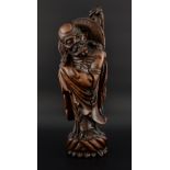Chinese carved hardwood figure of a man with a wide brimmed hat and fly swat, 36.5cm high,