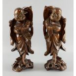 Pair of Chinese root carvings of men with hats and fly swats, on naturalistic bases, 32cm high,