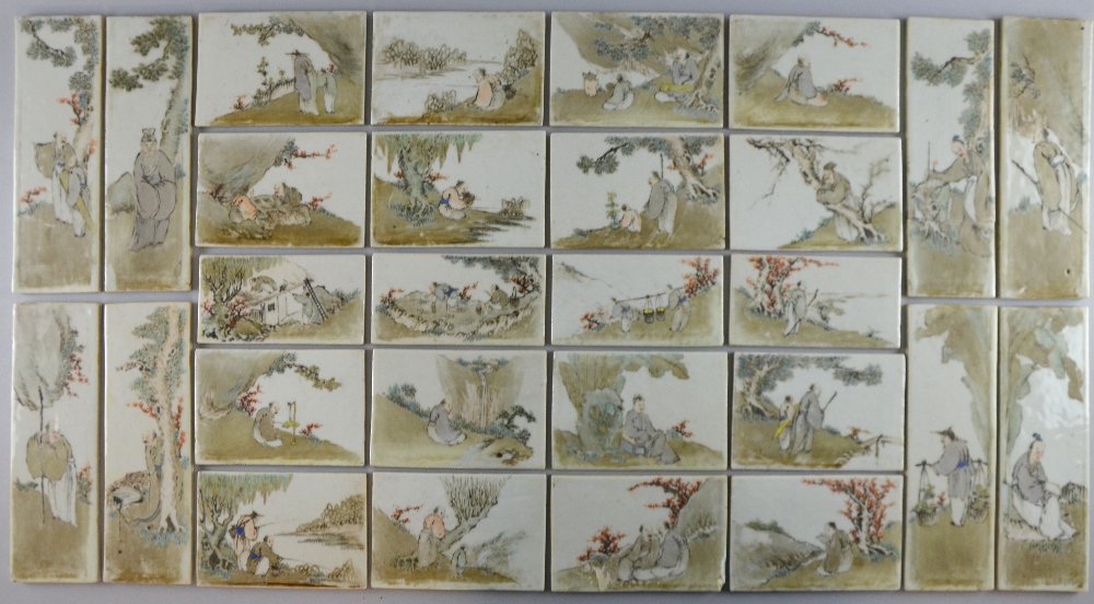 Set of twenty-eight late 19th/ early 20th century Chinese porcelain tiles depicting figures at