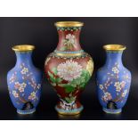 Pair of 20th century Chinese cloisonne vases, the blue ground decorated with a bird and prunus