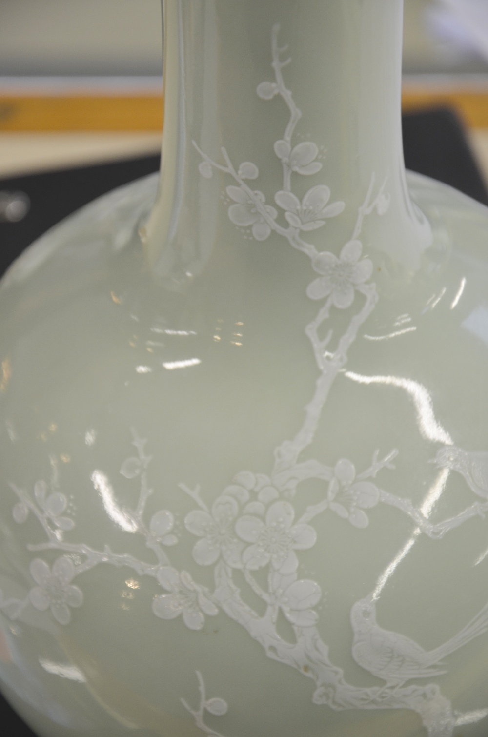 Chinese porcelain bottle vase, the pale celadon ground enamelled in white with two birds in a prunus - Image 6 of 6