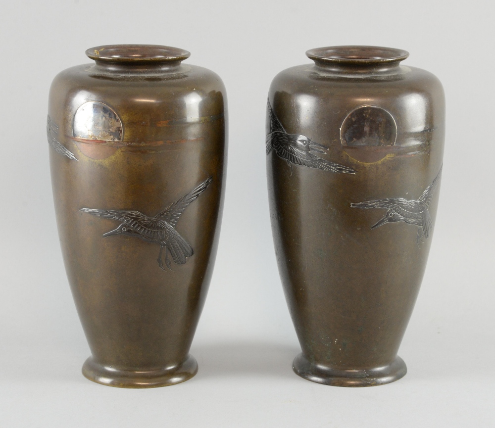 Pair of Japanese Meiji period bronze vases decorated with crows in front of a setting sun, 22cm
