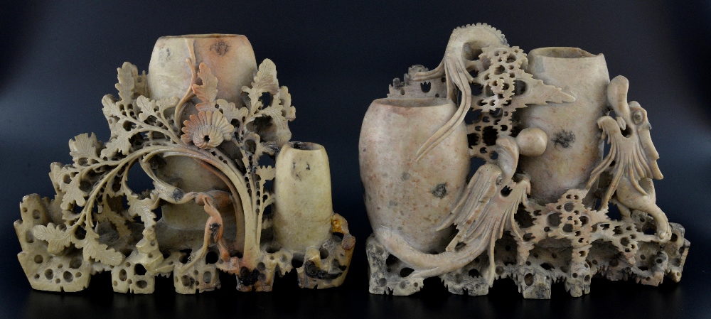 Two Chinese soapstone vase groups, the first carved with dragons, the other with birds, each