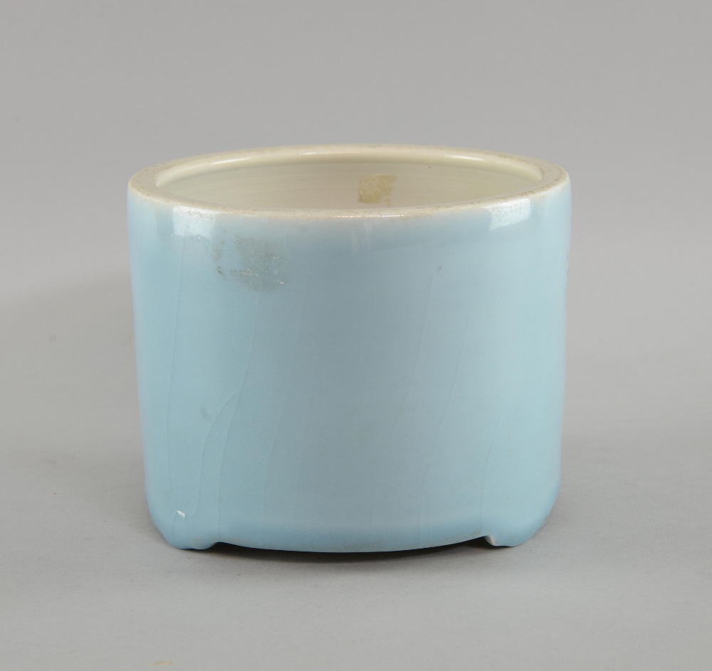 Chinese porcelain light blue brush pot on three shaped feet, 14cm high,