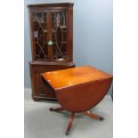 Mahogany corner cabinet with astragal glazed door and a drop flap dining table