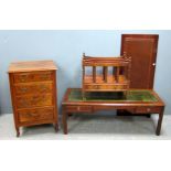 Walnut chest of four drawers, coffee table, folding table, x framed stool and a canterbury