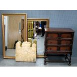 Oak chest of three drawers, Decorative carved stone wall panel and two gilt framed mirrors