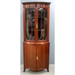 Mahogany bowfronted corner cabinet with astragal glazed doors