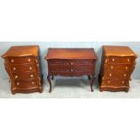 Pair of serpentine bedside chests and a side table