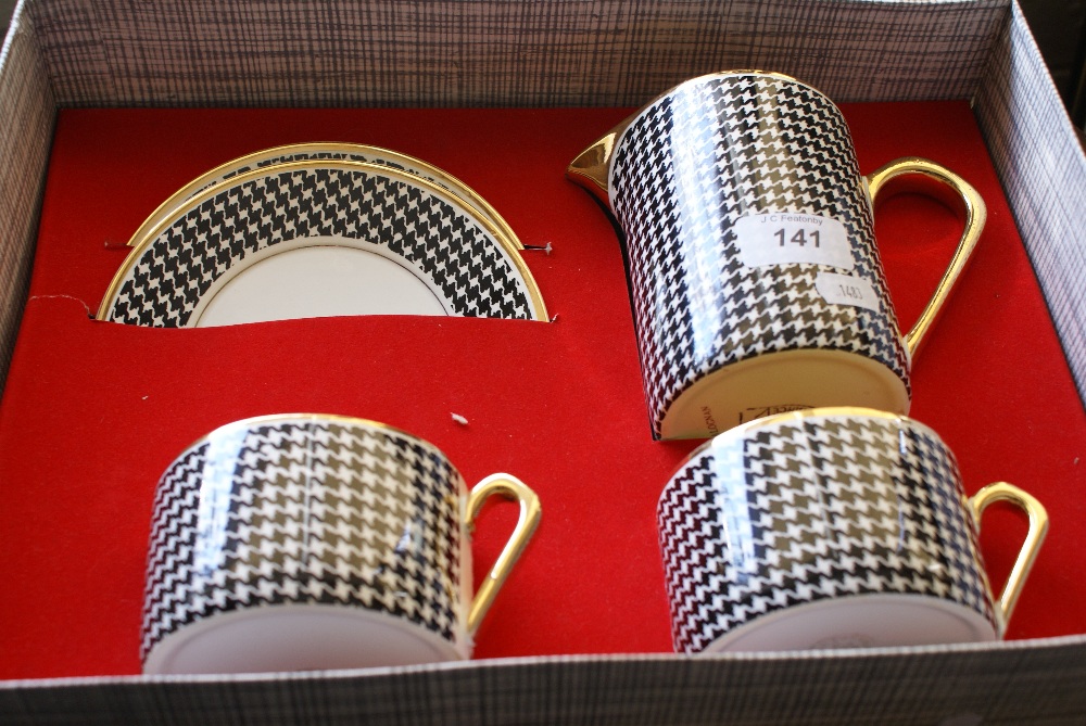 Boxed set of Hound's-tooth pattern 2 cups, 2 saucers and matching jug by Salinas,