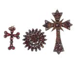 Two garnet and red paste pendants and a brooch, the late 19th century brooch of circular, tiered