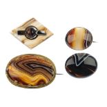 Four banded agate brooches, the first designed as a diamond-shape panel with shaped bar centre,