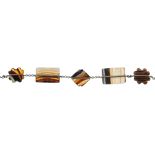 A banded agate bracelet, designed as five carved, shaped panels to the fine belcher-link chain and