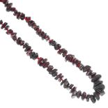 A selection of three garnet bead single-strand necklaces, to include a circular bead necklace, a