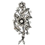 A paste floral spray brooch, the circular-shape colourless paste floral clusters, to the similarly-