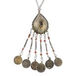 A white metal paste and dyed coral fringe necklace, the pear-shape domed pendant set with blue