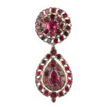 An early 19th century silver gilt, garnet pendant, designed as a pear-shape panel within a pear-