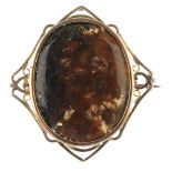 A mid 20th century 9ct gold hardstone brooch, of kite-shape outline, the oval agate cabochon collet,