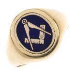 A 9ct gold Masonic ring. The rotating oval panel, with blue enamel Masonic symbol and engraved