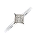 A 9ct gold diamond panel ring. The brilliant-cut diamonds, within a square-shape panel, off-set to