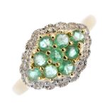 A 9ct gold emerald and diamond ring. Of marquise-shape outline, the circular-shape emerald