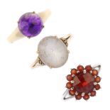 A selection of three 9ct gold gem-set rings. To include a circular amethyst cabochon ring, an oval-