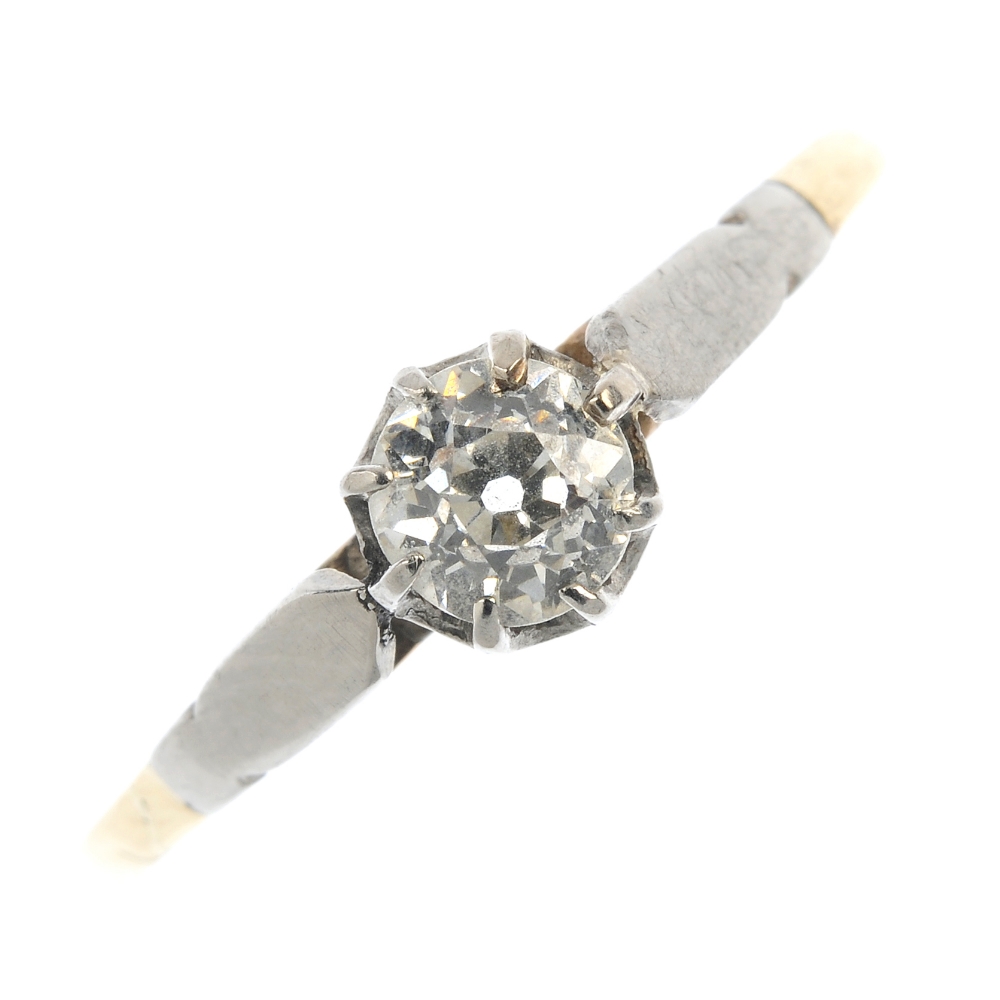 A mid 20th century 9ct gold diamond single-stone ring. The old-cut diamond, to the tapered shoulders