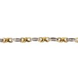 A diamond bracelet. The baguette-cut diamond tapered panels, with crossover intervals, to the