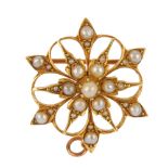 An early 20th century 15ct gold split pearl brooch. The split pearl cluster, within an openwork