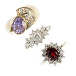 A selection of three 9ct gold gem-set dress rings. To include a garnet and cubic zirconia cluster