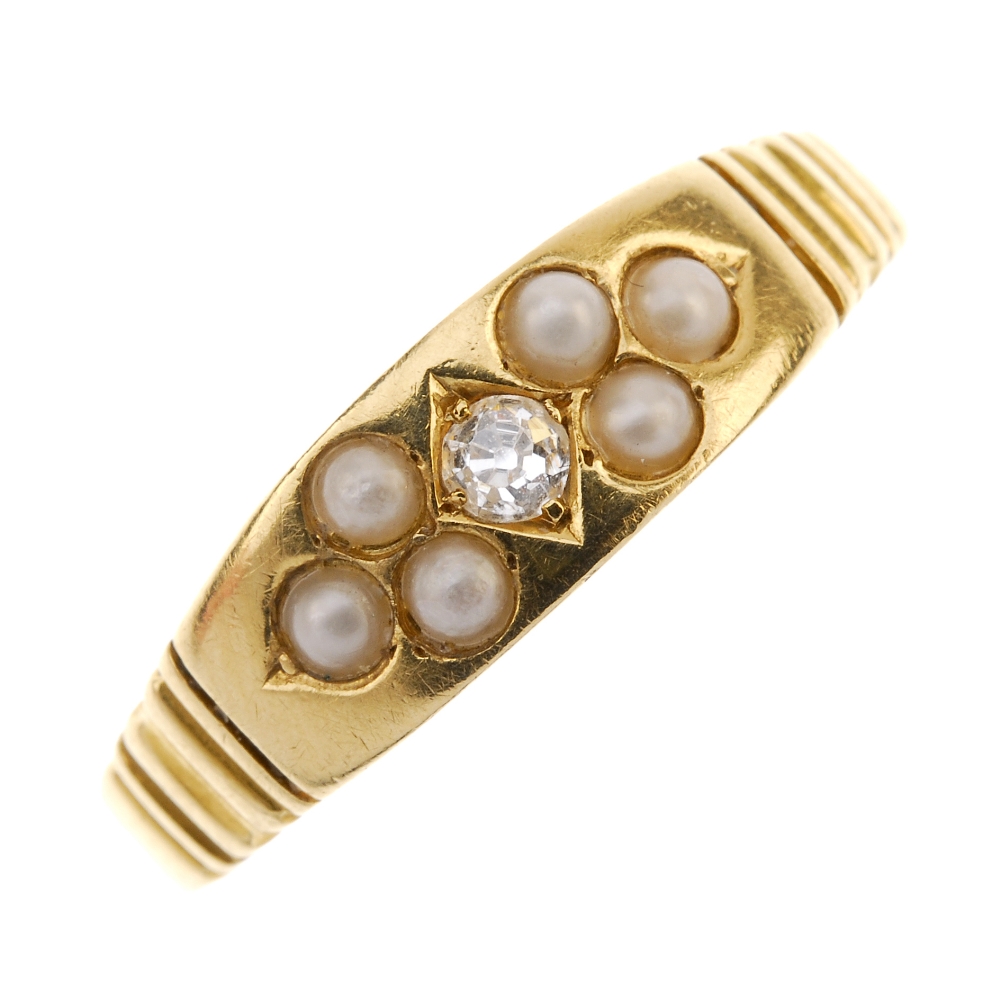 A late Victorian 18ct gold diamond and split pearl ring. The old-cut diamond, bordered by split