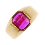 An 18ct gold synthetic ruby single-stone ring. The rectangular-shape synthetic ruby, inset to the