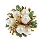 A 1970s 14ct gold cultured jade and cultured pearl floral dress ring. Of bombe design, comprising