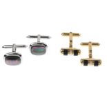 A pair of 9ct gold gem-set cufflinks. The first each designed as a cylindrical panel, inset with